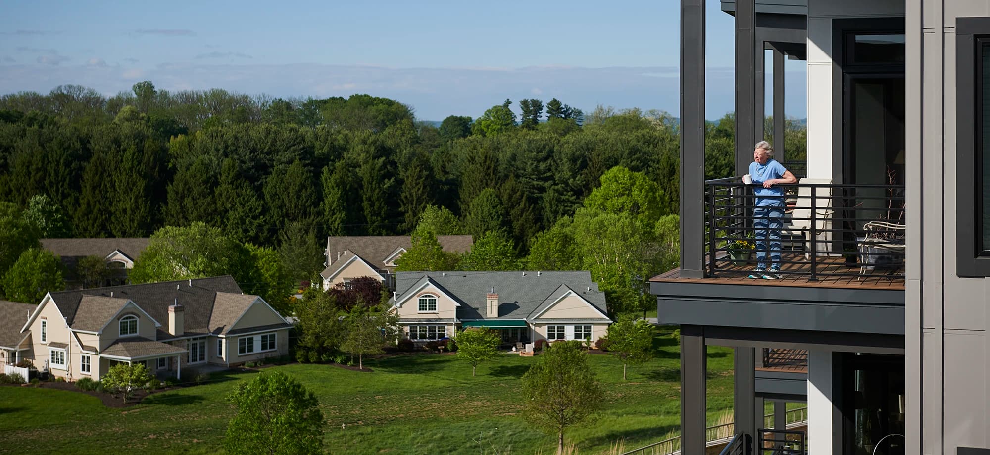 Woman on deck drinking coffee